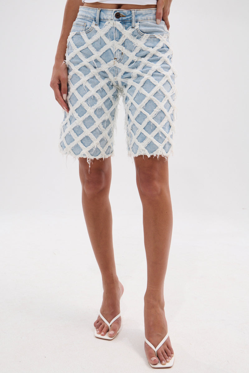 DISTRESSED AND STRESSED DENIM BERMUDA SHORT