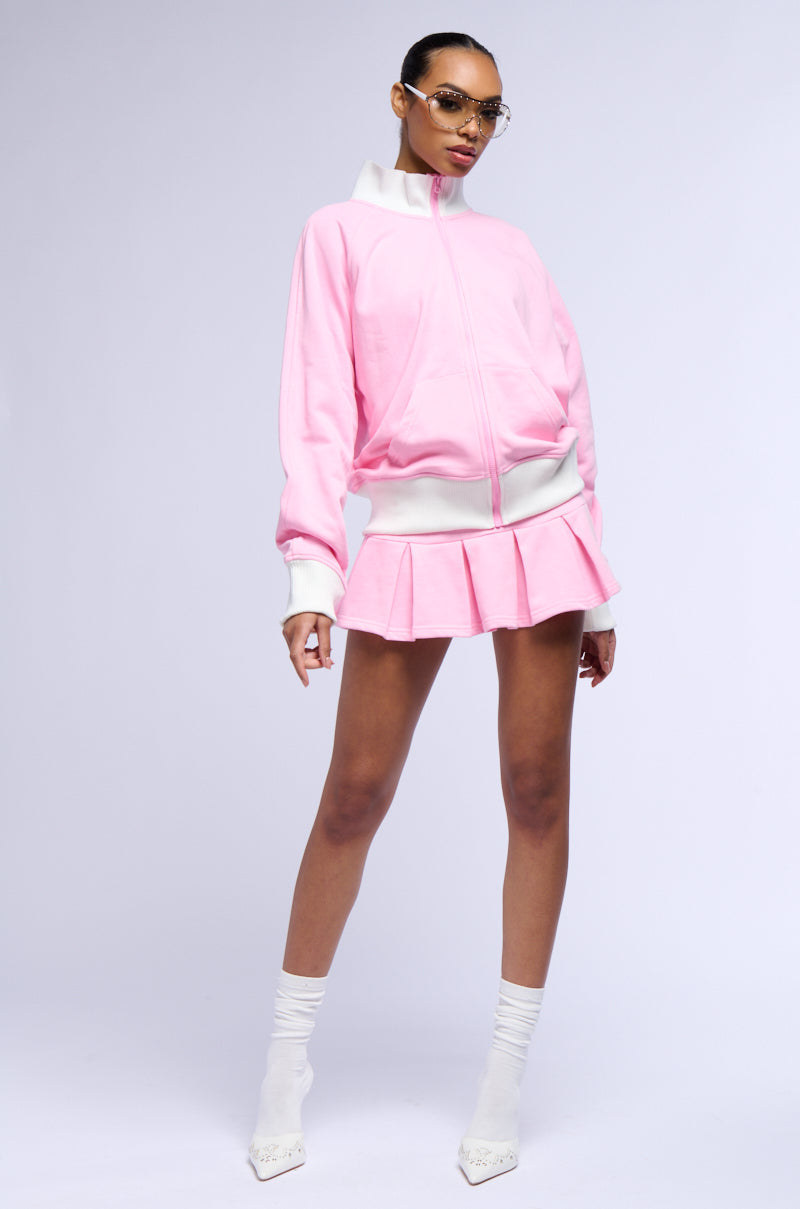 CALL ME BABY PLEATED MINI SKIRT IN PINK
